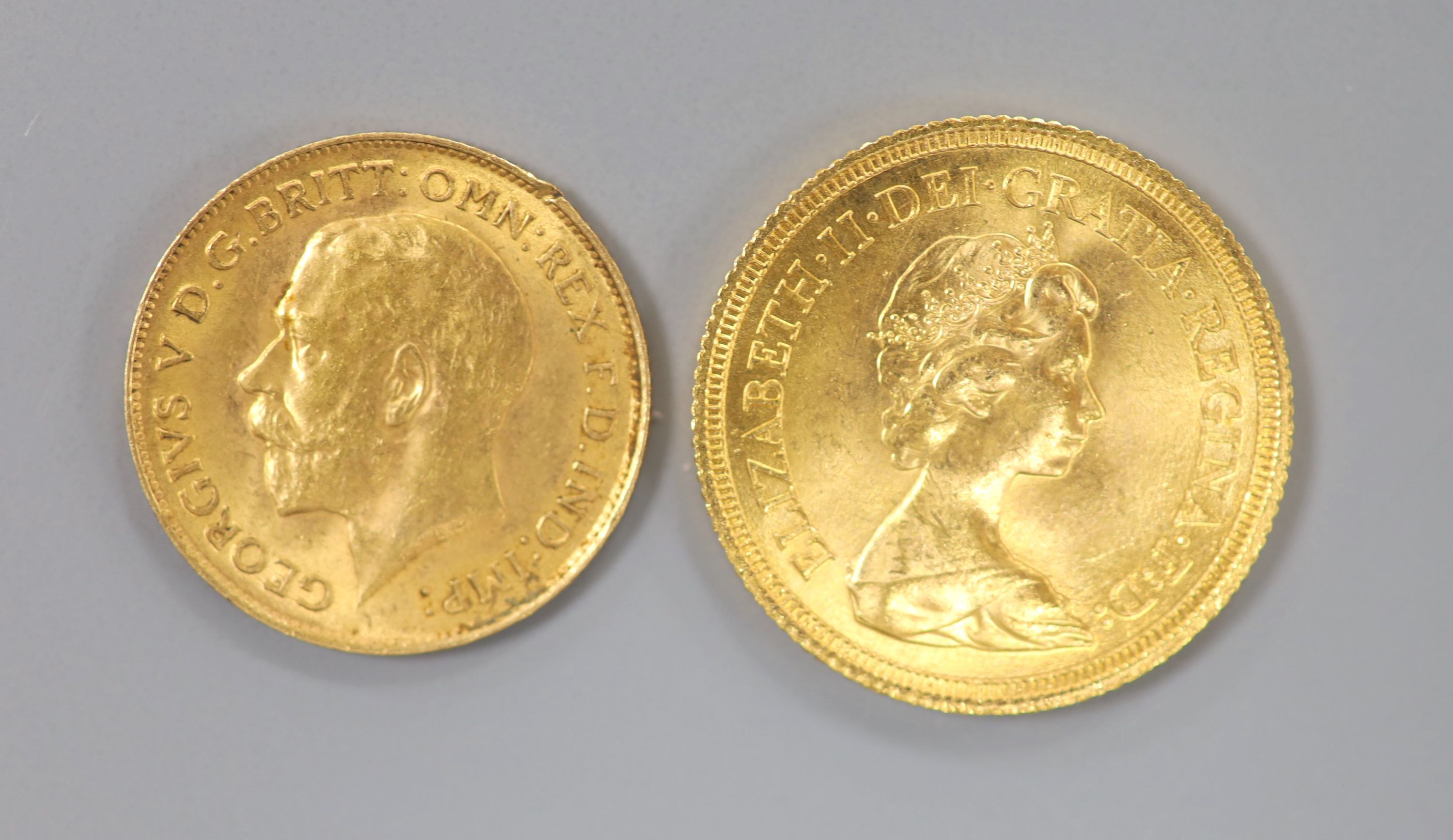 An Elizabeth II 1974 gold sovereign and a George V 1912 gold half sovereign.
